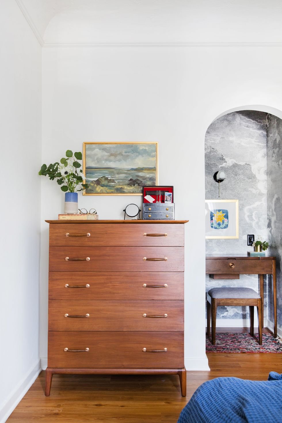 bedroom with cutout wallpapered nook